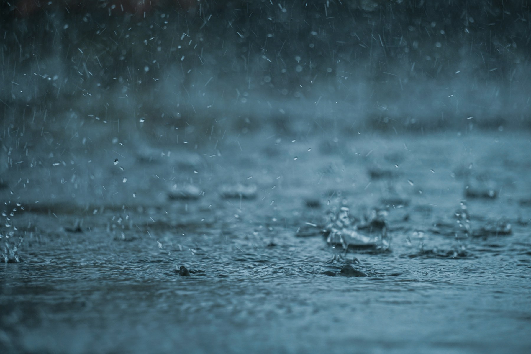 Heavy rain splashing across water during a severe Florida storm