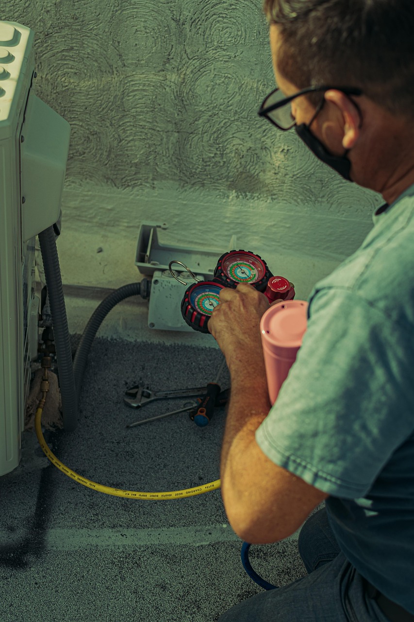 Technician servicing spa equipment during routine maintenance